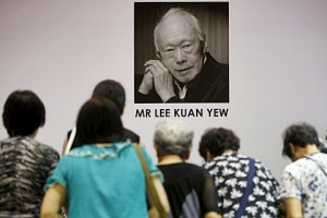 People bow as they pay their respects to the late former prime minister Lee Kuan Yew at Tanjong Pagar community club, in the constituency which Lee represented as Member of Parliament since 1955, in Singapore